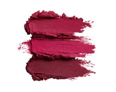 Close-up of three crimson lipstick swatches