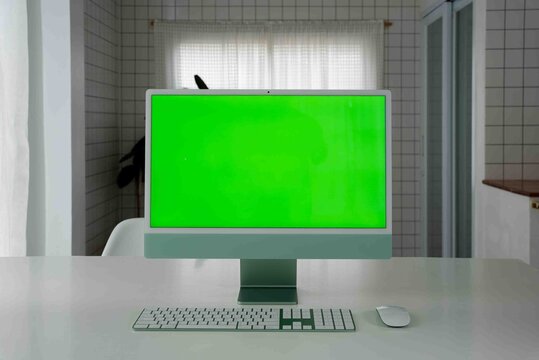 Laptop Computer with Green Screen on a Home Work Desk, High-Quality 4K HD Footage