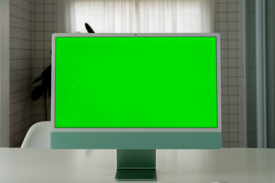 Laptop Computer with Green Screen on a Home Work Desk, High-Quality 4K HD Footage