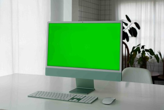 Laptop Computer with Green Screen on a Home Work Desk, High-Quality 4K HD Footage