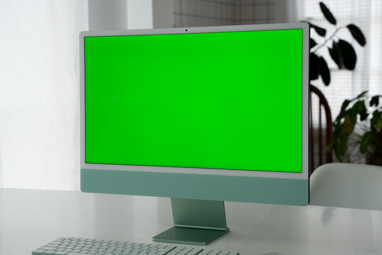 Laptop Computer with Green Screen on a Home Work Desk, High-Quality 4K HD Footage