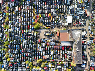 Aerial view of a full car scrapyard with old broken vehicles