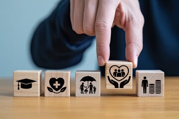Hand placing wooden block with family care symbol on a row of financial planning icons