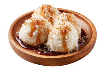 Coconut rice balls or dumplings topped with syrup and shredded coconut on wooden plate, isolated on white transparent background, concept of Polynesian Snacks Faikakai dessert cuisine