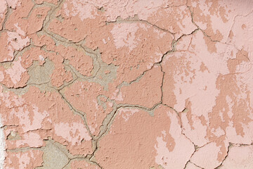 A wall with a pink and white paint job