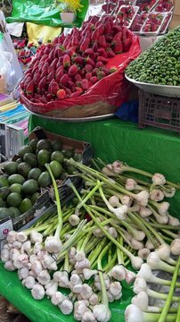 Raw almond and strawberries in grocery store Iran Tehran Tajrish agriculture bazaar farmers market fresh fruit healthy organic produce product colorful lifestyle vendor traditional stall green market