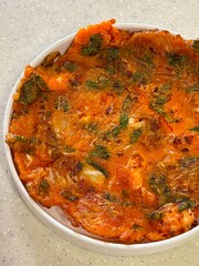 Crispy kimchi jeon, a savory Korean pancake made with fermented kimchi and flour batter. Perfectly golden, tangy, and slightly spicy, offering a delightful balance of textures and flavors.