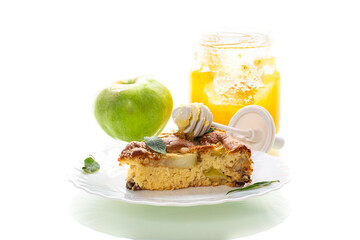 Ruddy crust of an appetizing apple pie on a white background