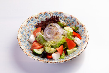 Greek salad on a plate.
