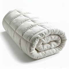 Rolled white quilted blanket on a simple white backdrop with soft shadows