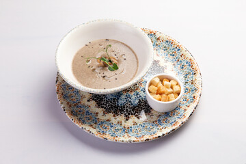 Cream of mushroom soup in a bowl.