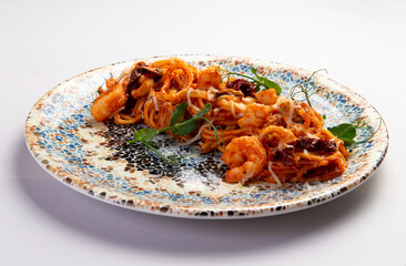 Pasta with shrimp on a plate.