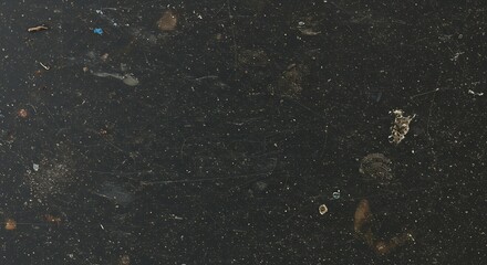 Textured black surface with imperfections suitable for abstract design