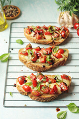 Freshly made bruschetta sandwiches - traditional dish of Italian cuisine	