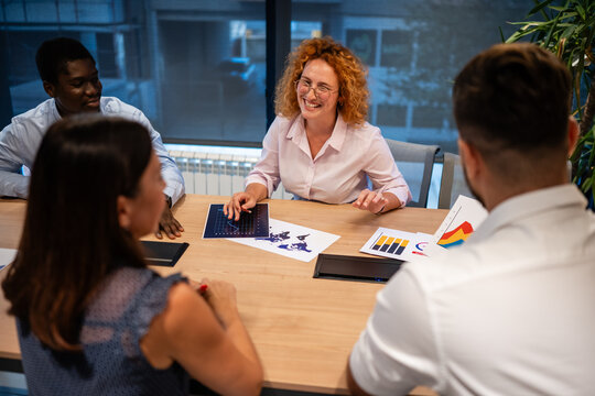 Business team brainstorming with charts during meeting