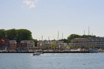A Beautiful and Serene Coastal View Featuring Boats, Marina, and Vibrant Blue Skies