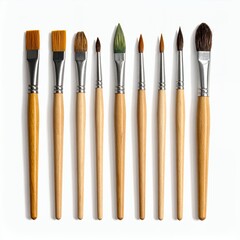 Artistic array: A collection of diverse paintbrushes arranged on a pristine white backdrop