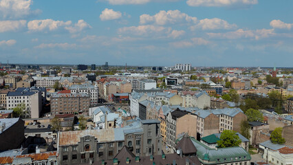 Aerial Drone View Of Riga Panorama In Latvia On A Sunny Spring Day Showcasing The Rooftops Of Houses The Vibrant City Center Historic Buildings And Barona Street Playground of the Downtown Sports Area