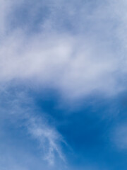 Soft White Clouds Floating in Blue Sky Background