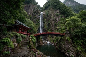 Lush Japanese valley with waterfall, red bridge & temple
