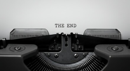 Typewriter printing the end on paper with close up view