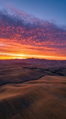 Naklejka premium Sunrise Over Rural Landscape With Dramatic Clouds