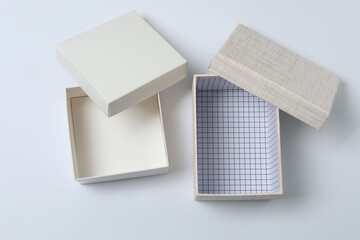 empty paper box with lid on white background, top view