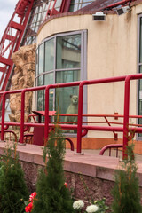 lioness in the zoo building behind glass