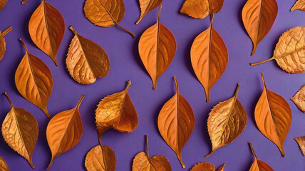 Pattern of dry orange metallic leaves on violet background.