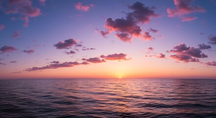 Vibrant sunset over ocean with dramatic clouds and colorful sky