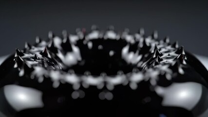 Dynamic ferrofluid spikes react to magnetic field experiment - Powered by Adobe