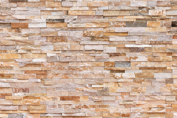 Rustic stone wall texture in high resolution, featuring weathered natural stones with earthy tones and detailed surface patterns. Perfect background for architecture, construction and masonry design.