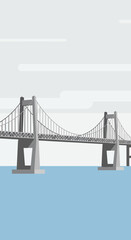 Obraz premium Suspension bridge spans across calm blue water under a cloudy sky.