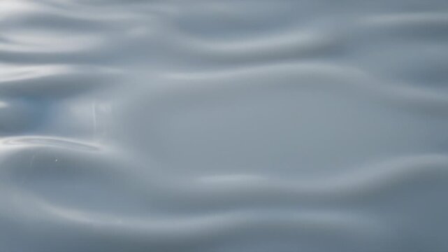 Smooth Flowing Liquid Surface with Gentle Ripples and Soft Reflections - Powered by Adobe