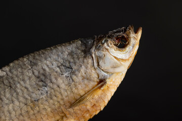 one dry fish for long-term storage by dehydrating whole fish in the sun, semi-finished product of dehydrated and dried fish in scales ready for human consumption