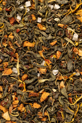 a large amount of green tea with the addition of fruits and berries, dry high-quality expensive tea for the tea ceremony with the addition of natural flavors