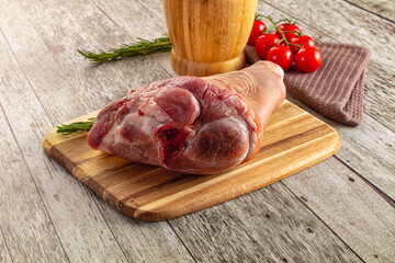 Raw pork knuckle over board