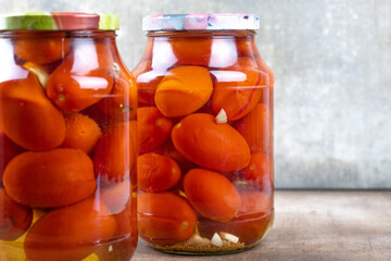 Pickled tomatoes in jars.