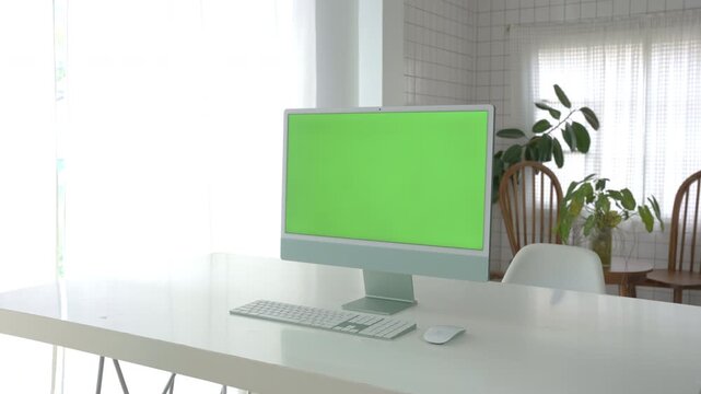 Laptop Computer with Green Screen on a Home Work Desk, High-Quality 4K HD Footage