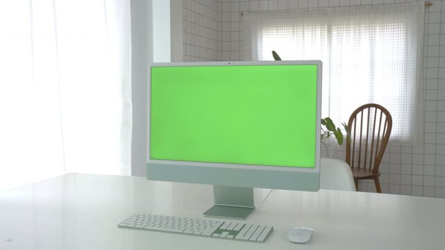 Laptop Computer with Green Screen on a Home Work Desk, High-Quality 4K HD Footage