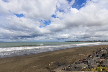Beach with a cloudy sky in the background