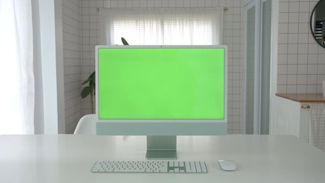 Laptop Computer with Green Screen on a Home Work Desk, High-Quality 4K HD Footage