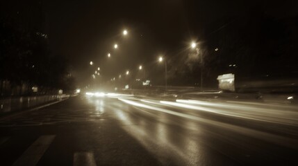 rainy night urban street with streaking car lights and wet reflective road surface