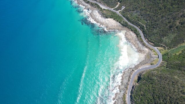 Coastal road on the beautiful ocean coast of Australia. Blue sea and beautiful beaches view from above.