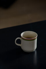 A cup of freshly brewed strong and black homemade coffee for a good mood