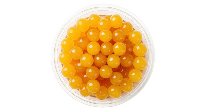 Orange tapioca pearls in a bowl isolated, boba balls for bubble tea on transparent background, sweet dessert ingredient