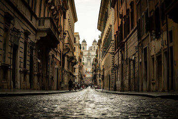 Obraz premium Perspective of Spanish Steps and Trinità dei Monti Church from Via dei Condotti in Rome, Italy