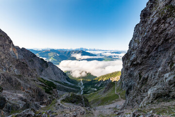 Fototapeta premium Panoramic view from Riemannhaus over Saalfelden across the Steinernes Meer to the Zillertal Alps