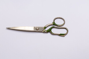 Antique tailor's cutting shears, top view on a white background