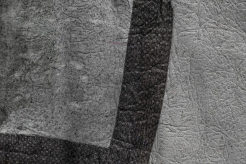 Texture of material for sewing gray-colored sheepskin coats